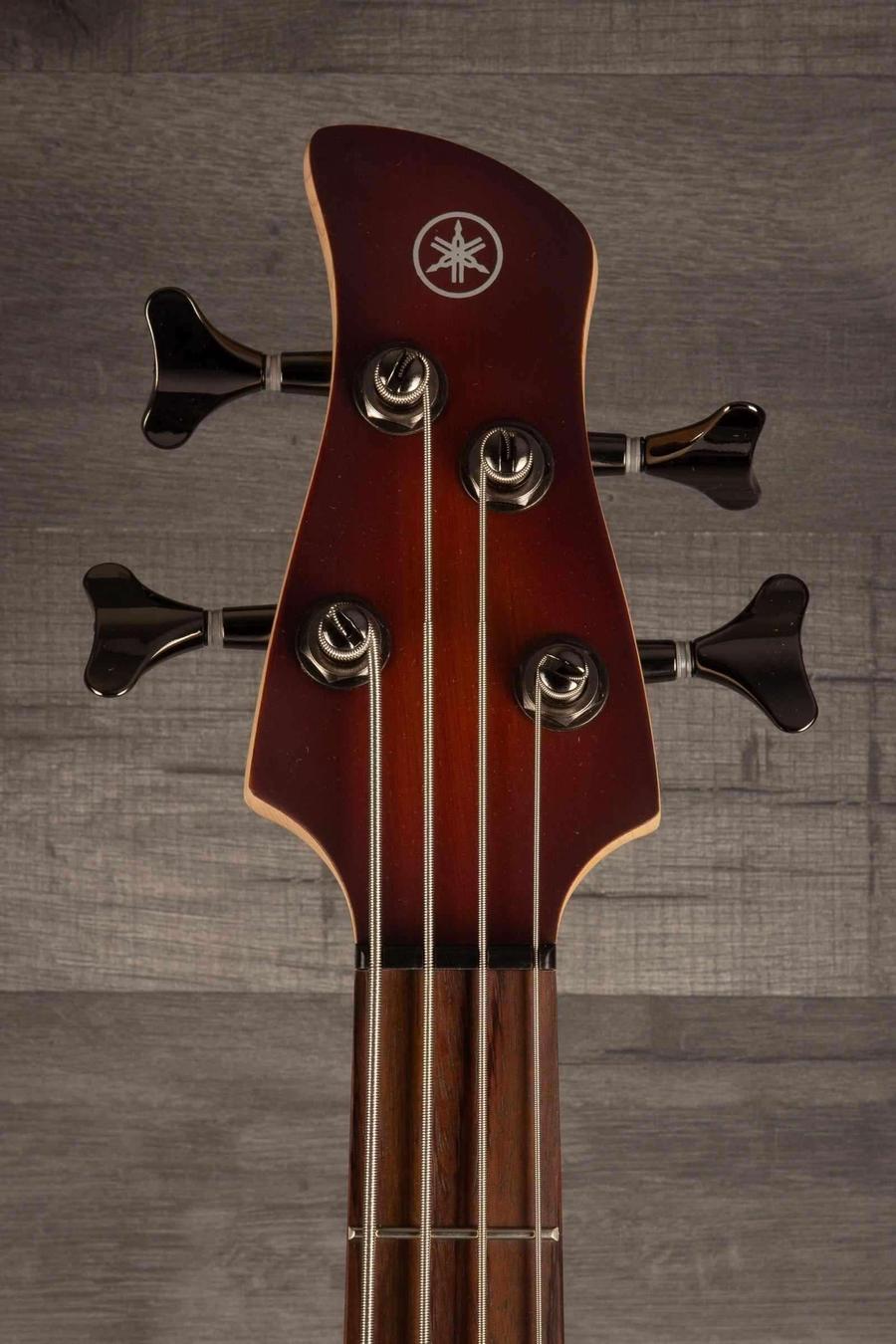 Yamaha TRBX504 Brick Burst Bass Guitar headstock with tuning pegs and logo