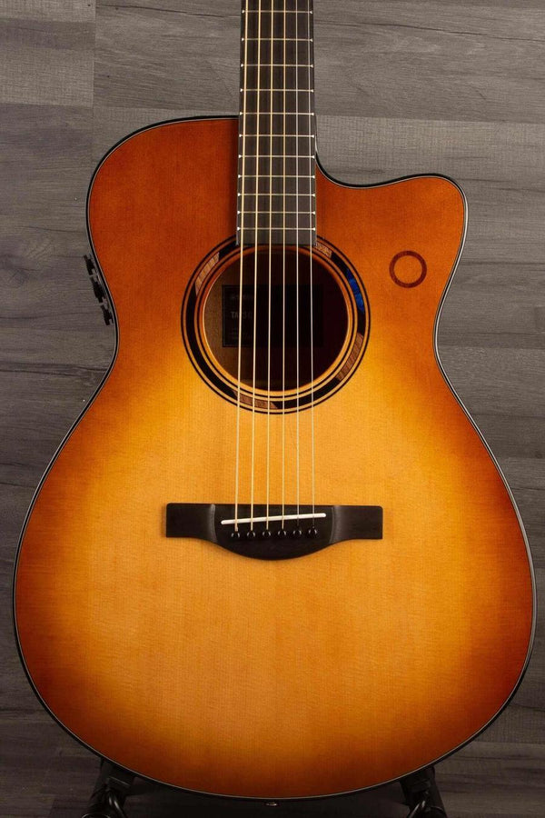 Yamaha TAS3C TransAcoustic Guitar - Sandburst featured in close-up on a wooden background.