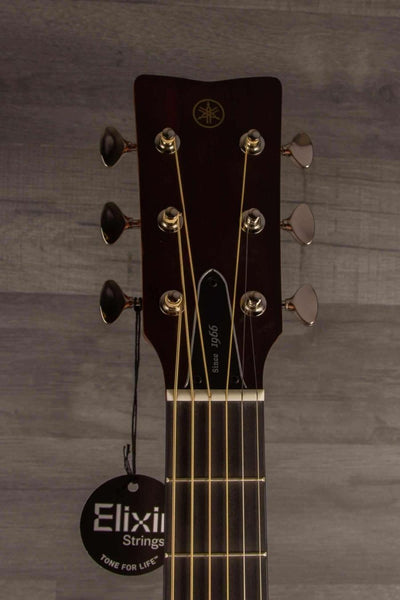 Yamaha FG5G - Acoustic Guitar headstock with Elixir Strings tag and tuning pegs