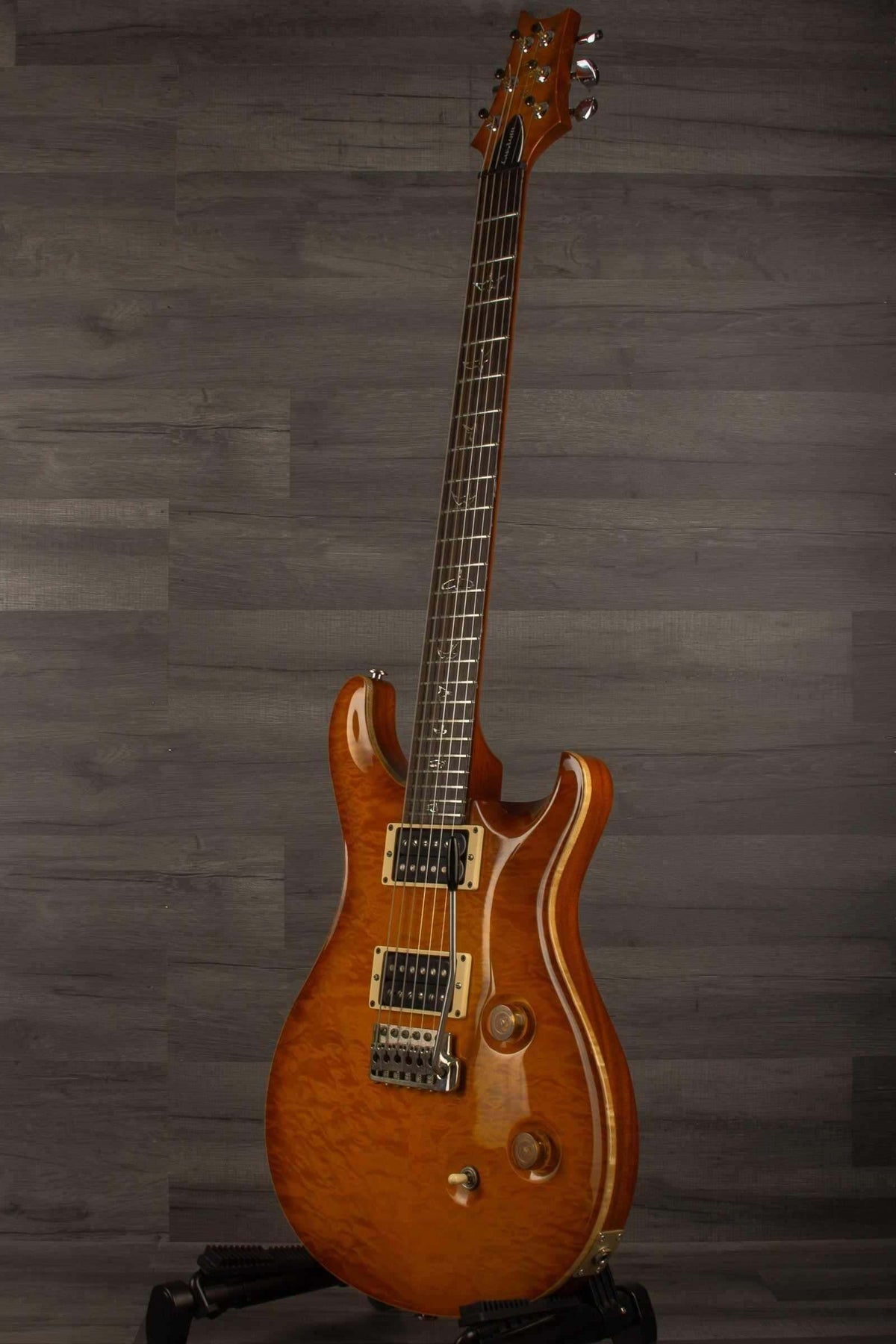 USED - PRS Custom 24 10 Top McCarty sunbuerst (player grade) 2011 electric guitar on display.