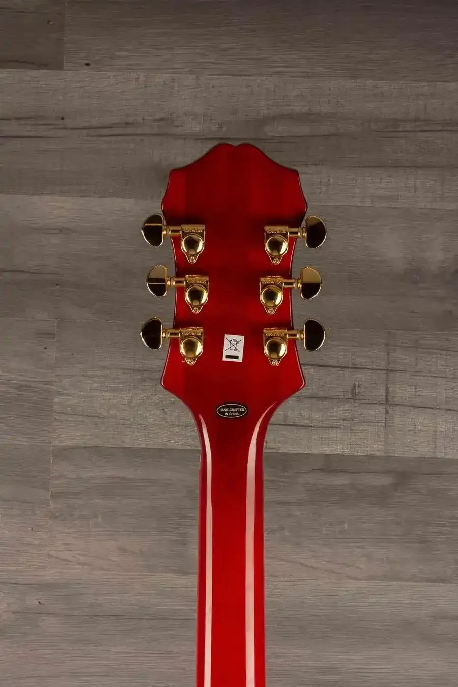 Epiphone Broadway Electric Guitar - Wine Red, Includes Premium Gig Bag headstock with gold tuning pegs on wood background.