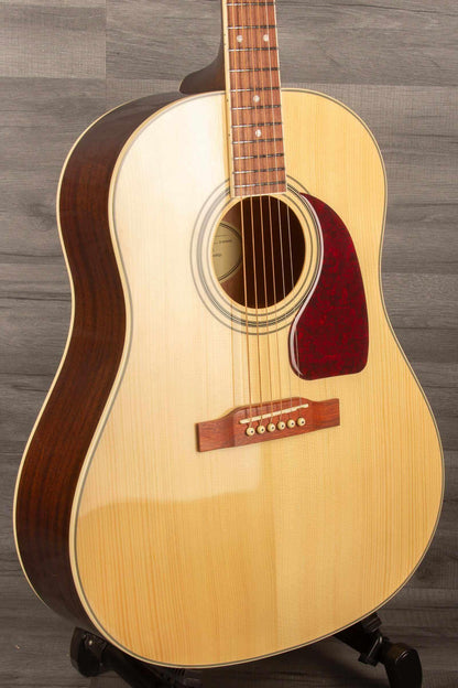 Epiphone J45 Studio Solid Top - Natural, Acoustic Guitar displayed at an angle, showcasing its quality construction and design.