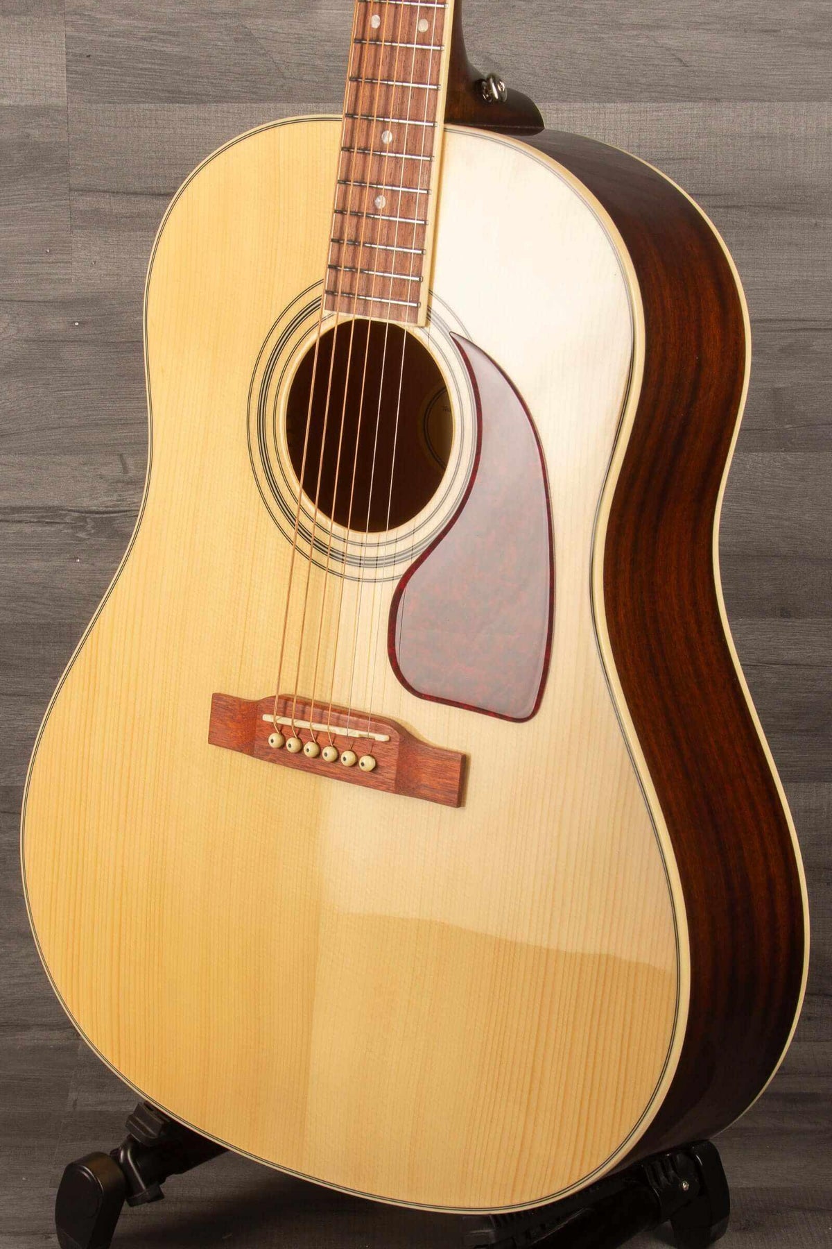 Epiphone J45 Studio Solid Top - Natural, Acoustic Guitar on display, highlighting its solid mahogany top and body.