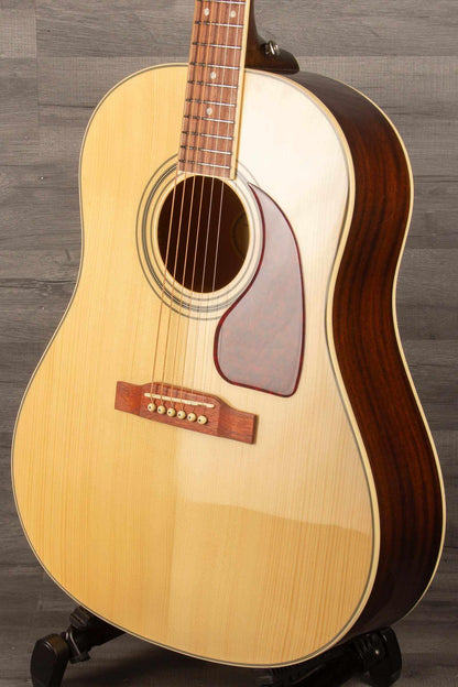 Epiphone J45 Studio Solid Top - Natural, Acoustic Guitar on display, highlighting its solid mahogany top and body.
