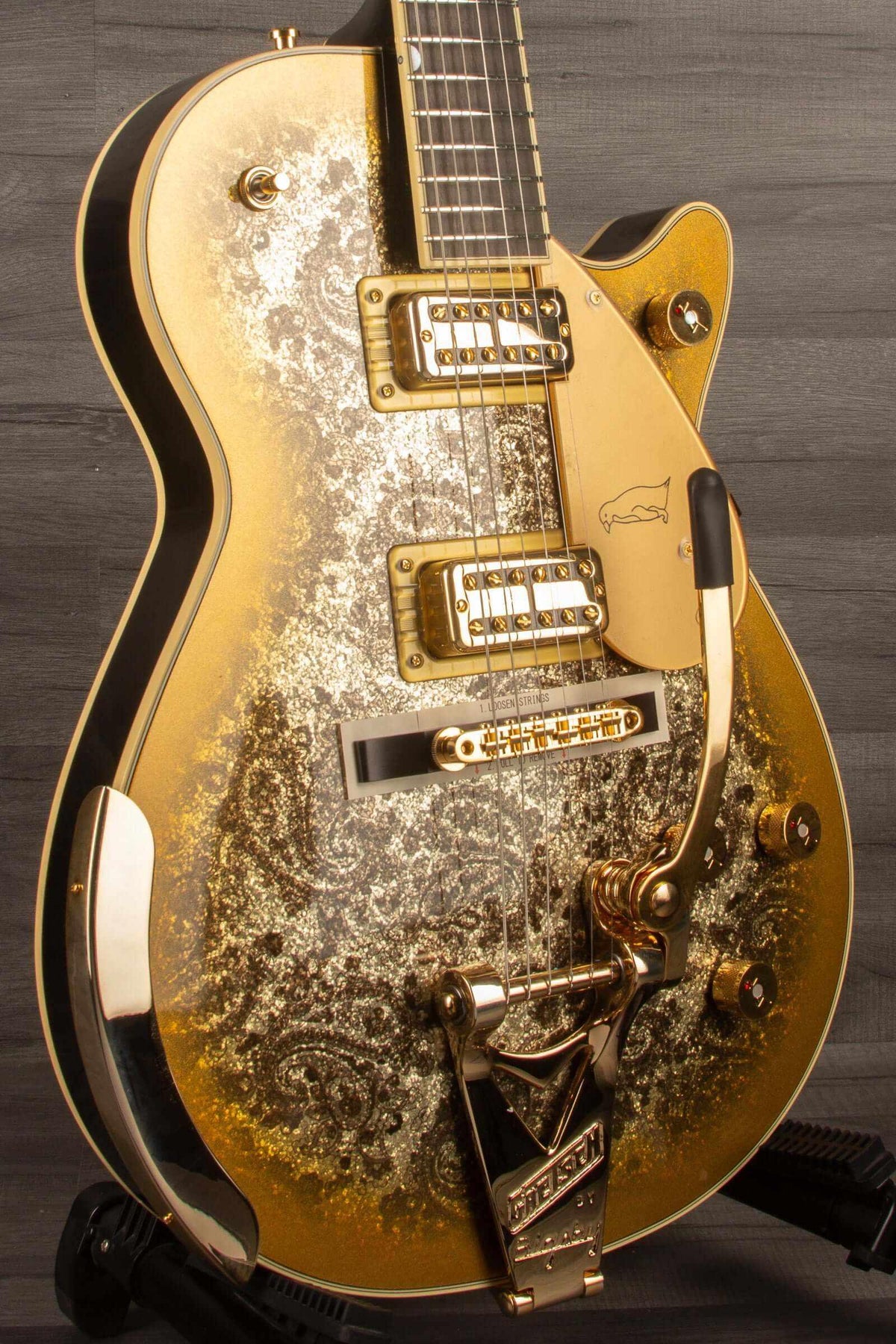 Limited Edition Paisley Penguin™ guitar with gold paisley finish, string-thru Bigsby®, and ebony fingerboard.
