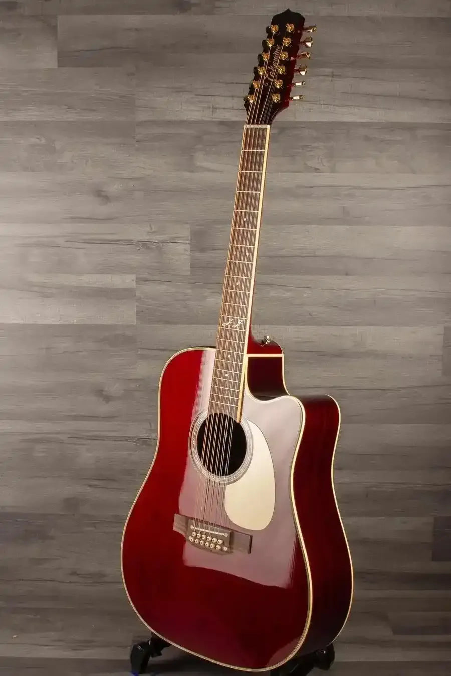 Takamine JJ325SRCL-12 John Jorgenson 12 string guitar with a striking red finish and elegant design.