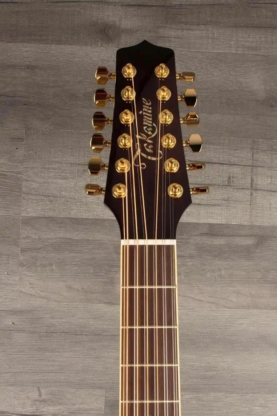 Takamine JJ325SRCL-12 John Jorgenson 12 string guitar headstock with gold tuning pegs.