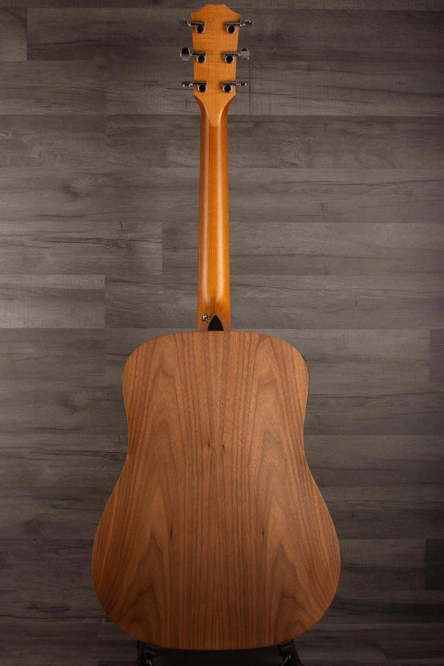 USED - 2022 Taylor 110e back view showcasing the guitar's stunning wood grain and craftsmanship.