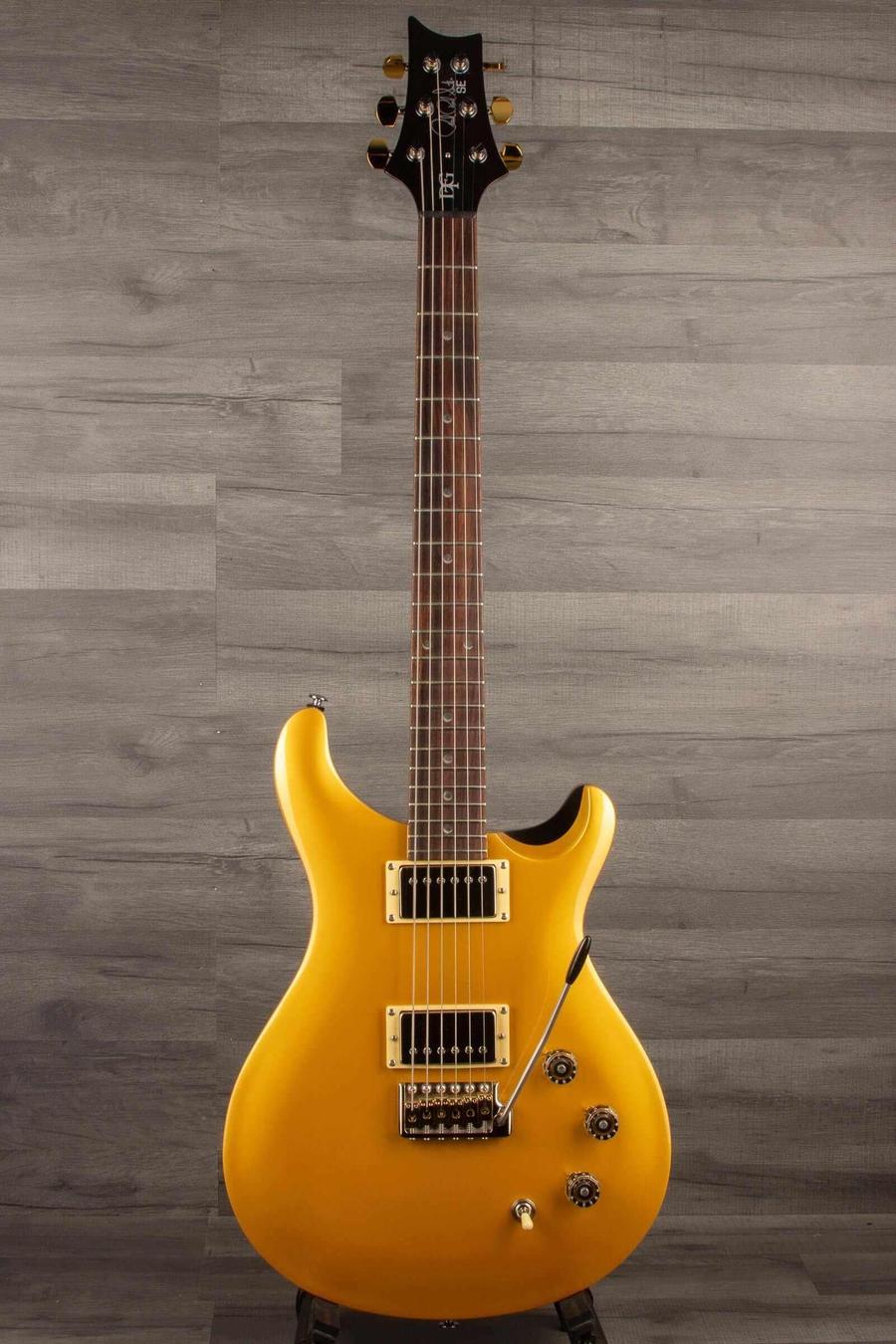 USED - PRS SE DGT Gold Top Electric Guitar in perfect condition with upgraded features, displayed on a stand.