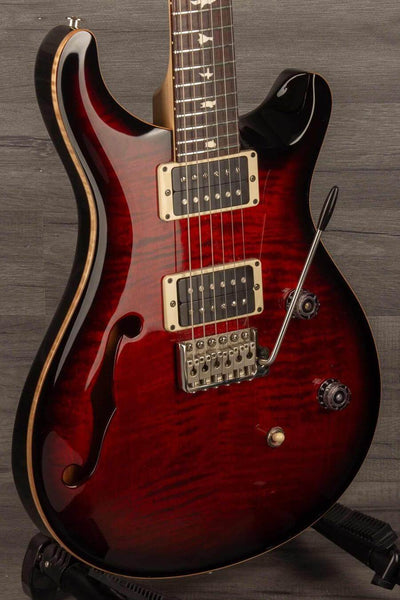 USED - PRS CE24 Semi Hollow - Fire Red in good condition with a glossy finish and F-hole design.