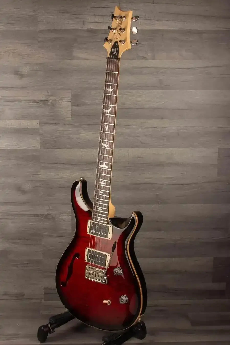 USED - PRS CE24 Semi Hollow - Fire Red guitar with F-hole design, mahogany body, and maple neck in good condition.