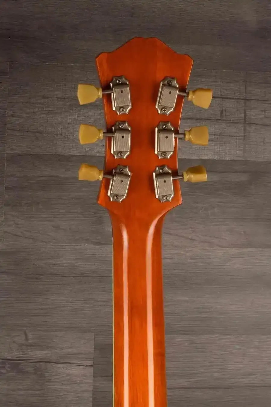 Back view of a USED - Eastman T64/V Antique Varnish guitar neck featuring six tuners.