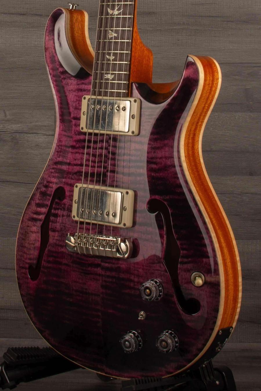 USED - PRS Hollowbody II Piezo Purple Iris displayed on a stand, featuring a beautiful figured maple top.