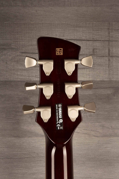 Yamaha RS502T FMX guitar headstock featuring tuning pegs and logo, showcasing its quality craftsmanship.