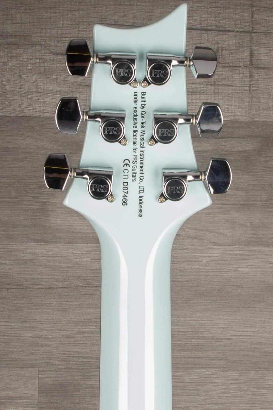 Back view of USED - PRS SE Starla in Powder Blue, showcasing tuning pegs and neck details.