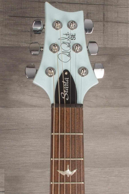 PRS SE Starla Powder Blue guitar headstock with signature and tuning pegs, showcasing its vintage-inspired design.